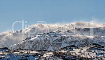 Scenic panoramic of snow capped mountain landscape in Bodo, Nordland, Norway against a clear blue sky background. Breathtaking and picturesque view of a cold and icy natural environment in winter