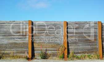Old wooden fence outside in a garden at home. The vintage architecture of an enclosure surrounding a house used for privacy, designing, and landscaping to decorate or protect a house with copy space