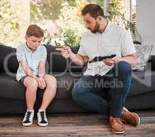 I think Ive heard enough out of you. Shot of a father losing his patience with his son at home.