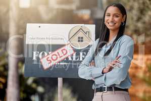 Proud, confident, always on call. Shot of a real estate agent standing next to a sold sign outside.