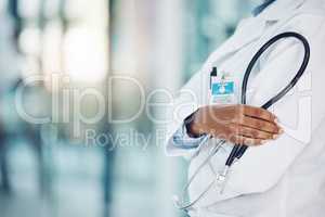 Closeup african american woman doctor standing with a stethoscope in the hospital. I need to listen to your heart beat. Come in for a medical checkup. Health and safety in the field of medicine