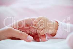 A tiny miracle in my hands. Shot of a mother holding her babys hand.