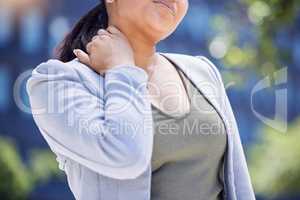 Ive been feeling tense all day. Closeup shot of an unrecognisable businesswoman experiencing neck pain in the city.