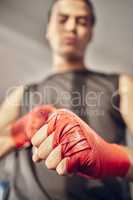 Closeup on hands of boxer with chalk on bandages. Hands of mma fighter ready for combat. Strong athlete with powder on bandage for boxing. Ready to throw a punch. Ready for boxing practice
