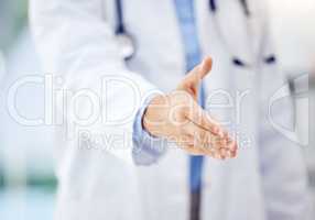 Allow me to introduce myself. Closeup shot of an unrecognisable doctor extending a handshake in a hospital.