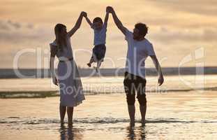 Beating the clock. a beautiful family bonding while spending a day at the beach together.