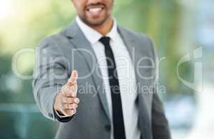 Onboarding new staff. Cropped shot of an unrecognizable businessman reaching out for a handshake while standing in his office.