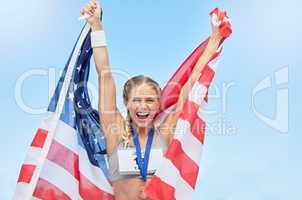 Female american winning athlete cheering and raising USA national flag after competing in sport. Smiling fit active sporty woman feeling motivated and excited, achieving a gold medal in Olympic sport