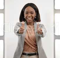 As is our confidence, so is our capacity.. a young businesswoman showing thumbs up in an office.
