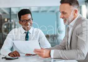 If we command our wealth, we shall be rich. two businessmen signing a contract in a office.