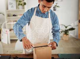 Packing, shipping and logistics in a modern workplace. Boxes being prepared for sending out