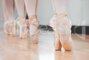 Ballet dancers may make it look easy, but we all know its anything but. Shot of a group of ballerina dancers practicing a routine in their pointe shoes.