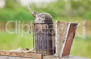 A bee smoker is one the tools youll need. Shot of a bee smoker on a farm.