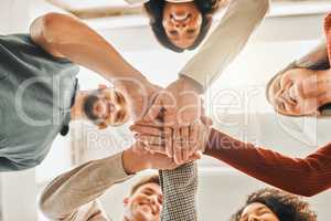 Businesspeople hands stacked from below.Diverse businesspeople motivating each other. Architects united together. Businesspeople celebrate with hands stacked from below. Businesspeople in a circle