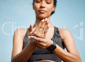 Every part of the body matters. a young woman massaging a cramp in her hand.