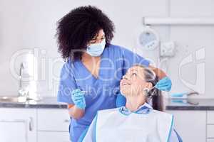 Dental impression prep. Shot of a woman and her dentist in the office.