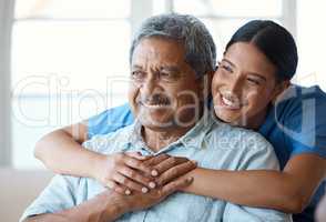 She goes above and beyond. a handsome senior man and his female nurse in the old age home.