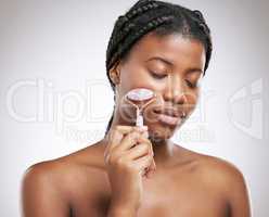 Because sometimes your face needs a masseuse. an attractive young woman posing in studio against a grey background.