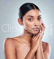 Shine bright like a diamond. Cropped portrait of an attractive young woman posing in studio against a grey background.