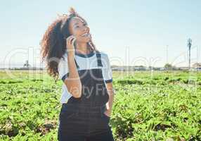 you wont believe what ive grown. a young female farmer using her phone to make a call.