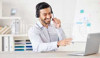 Happy businessman working in a call center. Customer service rep helping on a call. Sales agent speaking to client. IT assistant helping a customer. Telemarketing agent using headset to talk to client