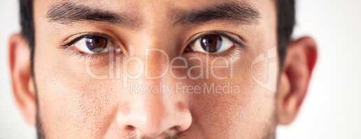 Closeup of an unknown asian mans face and eyes looking forward and into the camera. Zoom headshot of a mixed race man staring and watching in front. Healthy eyecare for clear optics and vision