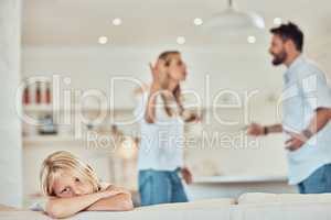 Portrait of sad little girl, parents fighting in the background. Depressed child, parents arguing at home. Couple in conflict around their daughter. Stressed caucasian girl parents divorcing