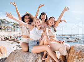 Life is beautiful but friendship makes it makes it extra special. Shot of a group of female friends spending time together at the beach.