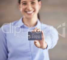 Businesswoman holding credit card. Smiling businesswoman shopping online with a debit card. Happy woman using card to pay bills. Portrait of businesswoman holding a bank card.