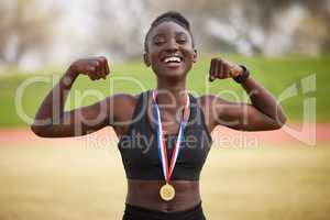 Strong body, strong mind. Cropped portrait of an attractive young female athlete celebrating her victory.