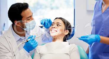 I cant wait to see your work. a young woman having a dental procedure performed on her.