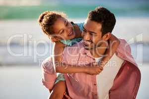 Spending time with her is the best part of my day. a man spending the day at the beach with his adorable daughter.