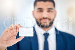 This is all the information you need. a young businessman showing a business card at work.