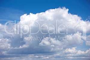 Panoramic cloudscape view of a fluffy cumulus in a blue sky in summer with copy space. High scenic and copy space views of a cloudy atmosphere and climate in a natural environment during the day