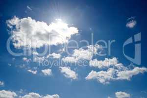 Copy space with altocumulus clouds in a clear blue sky from below. Beautiful panoramic of fluffy white cloudscape background for cool climate and season of sunny weather in the atmosphere outdoors