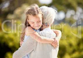 Live your life with love as your guiding principle. Shot of an elderly woman spending time outdoors with her granddaughter.