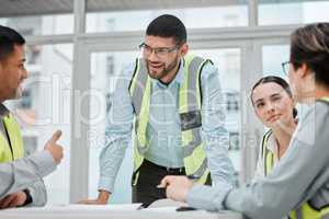 Its important to get everyone on the same page. Cropped shot of a group of young constructions having a meeting on their building site.