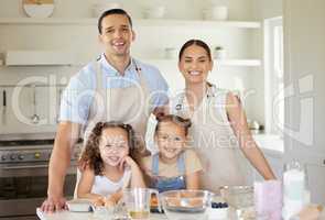 Were a family of bakers. a young family baking together at home.