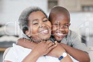 Family is not an important thing. Its everything. Shot of a boy and his grandma bonding at home.