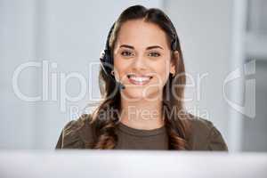 Please hold. Cropped portrait of an attractive young female call center agent working at her desk in the office.