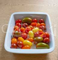 Closeup of cherry tomatoes ready to cook in a kitchen from Juicy red, yellow and green tomato in a bowl at a restaurant. A superfood that will be added to a healthy, nutritious meal for health