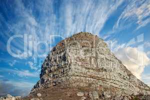 Copyspace with scenic landscape view of Lions Head mountain in Cape Town South Africa against a cloudy blue sky background from below. Magnificent panoramic of a famous attraction and iconic landmark