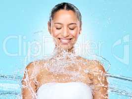 Always practice good hygiene. Studio shot of clean water splashing against a woman.