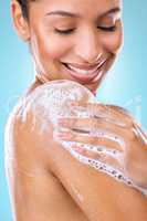 I love a body wash that bubbles up instantly. Cropped shot of a woman using a body wash on her skin.