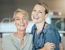 Two happy smiling women only showing the bond between patient and doctor during a checkup at home. A doctor showing support for her patient during recovery
