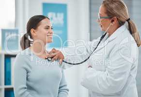 I can tell the treatment has been working well for you. a doctor examining a patient with a stethoscope during a consultation in a clinic.