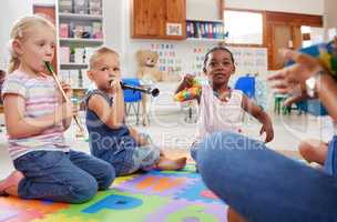 There are so many benefits of musical instruments for kids. children learning about musical instruments in class.