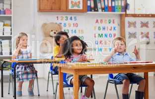 With preschool, your child gets a head start. Shot of a group of preschool students sitting in a classroom.