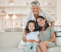 Theyre absolutely precious. a mature woman bonding with her daughter and granddaughter on the sofa at home.
