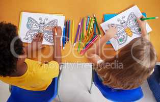 We love colouring. preschool students colouring in class.